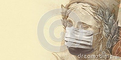 Coronavirus - A fifty brazilian reais banknote face wearing a mask Stock Photo
