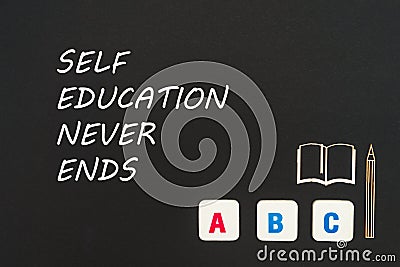 Abc letters and chipboard miniature on blackboard with text self education never ends Stock Photo