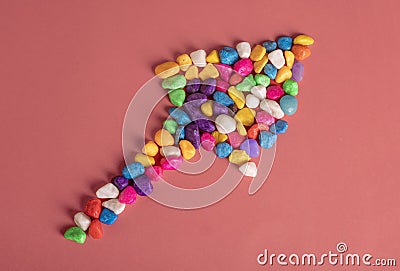 Concept of equal opportunities for all with colorful pebbles on red background Stock Photo