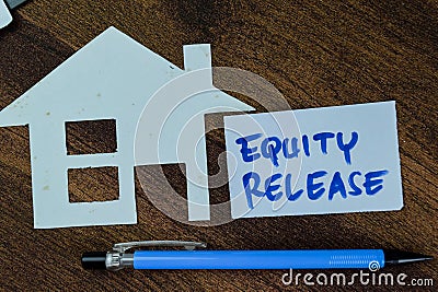 Concept of Equity Release write on sticky notes isolated on Wooden Table Stock Photo