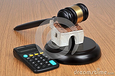 Various objects to illustrate a house auction on a wooden background Stock Photo