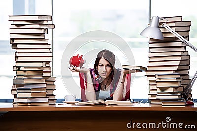 The concept of expensive textbooks with female student Stock Photo