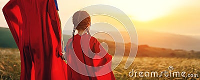 Concept of father`s day. dad and child daughter in hero superhero costume at sunset Stock Photo