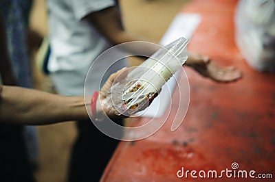 The concept of feeding : The hands of the poor receive food from the hands of the humane : Helping Feed the Poor Stock Photo