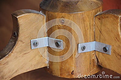 The concept of furniture repair failed. Rough repairs. Hitching with brackets. Stock Photo