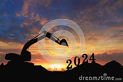 Concept happy new year 2024,crawler excavator silhouette Stock Photo