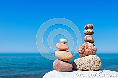 Concept of harmony and balance. Rock Zen on the background of summer sea Stock Photo