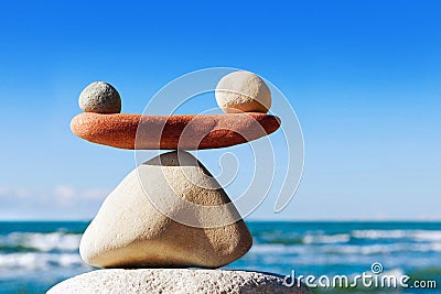 Concept of harmony and balance. Balance stones against the sea. Stock Photo