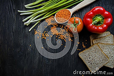 The concept of healthy eating. Balanced healthy eating background. Lentils, white bread, vegetables, greens on a dark wooden Stock Photo