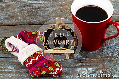 Concept HELLO january message on blackboard with a Cup of coffee Stock Photo