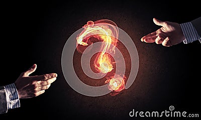 Concept of help or support with fire burning question mark and c Stock Photo