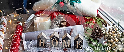 Concept of Home and comfort. Christmas decor Warm sweater, candles, Christmas tree. Word Home. Winter mood, Cozy Home Stock Photo