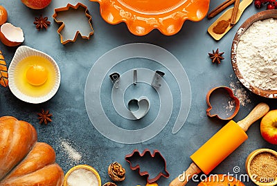 Concept homemade fall baking with pumpkin,apples, food ingredients, spices and kitchen utencil Stock Photo