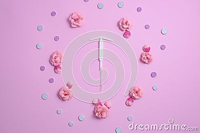 Concept hormonal contraception - pills and IUD. Paper flower Stock Photo