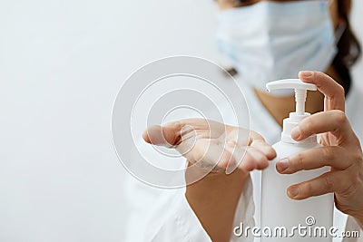 Concept of hygine and health care. Hand pumping alcohol gel or sanitizer gel to others hand for washing, cleaning hand for kill th Stock Photo