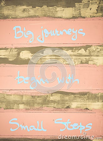 Concept image of Big Journeys begin with small steps motivational quote Stock Photo