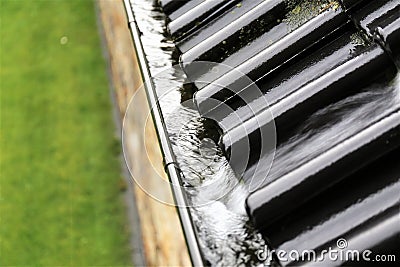 An concept image of a drain with raindrops - rain Stock Photo