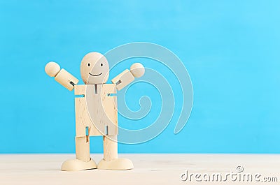 Concept image of happy mind and positive thinking. Wooden figure with smiling face Stock Photo