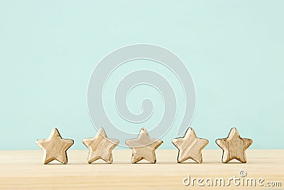 Concept image of setting a five star goal. increase rating or ranking, evaluation and classification idea. Stock Photo