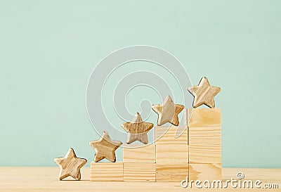 Concept image of setting a five star goal. increase rating or ranking, evaluation and classification idea. Stock Photo