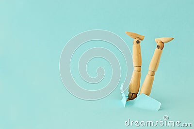 concept image of wooden dummy stuck upside down. stress and danger concept. Stock Photo