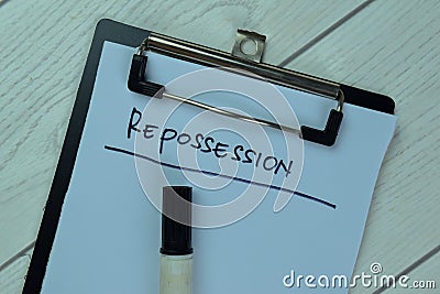 Concept of Info About Repossession write on a paperwork isolated on Wooden Table Stock Photo