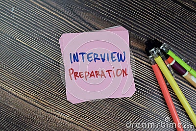 Concept of Interview Preparation write on sticky notes isolated on Wooden Table Stock Photo