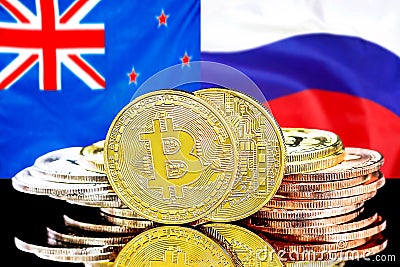 Bitcoins on New Zealand and Russia flag background Stock Photo