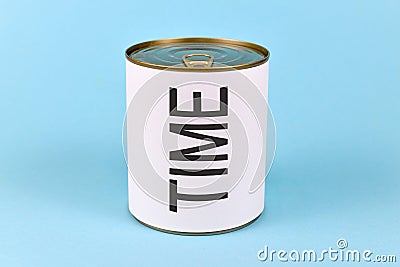 Concept of lack of time showing a tin can with white label and word `Time` on blue background Stock Photo