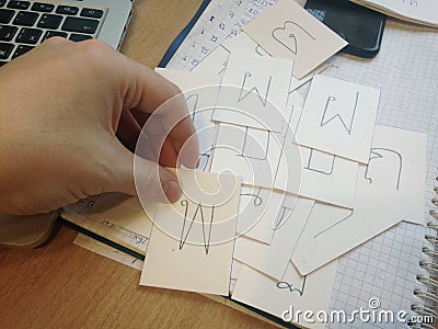 Concept of learning Thai language and the alphabet. Male hand holding card with the letter Stock Photo