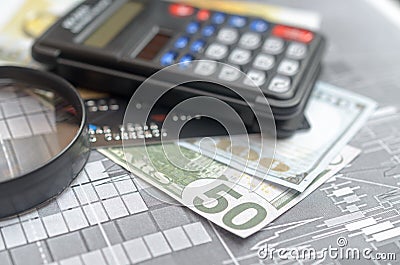 The concept of lending. Money, calculator, magnifier. Stock Photo