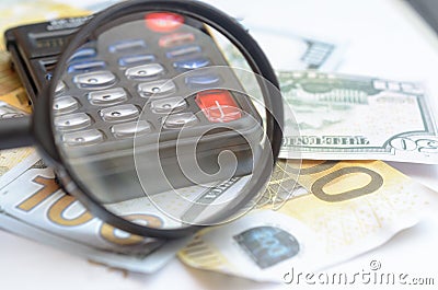 The concept of lending. Money, calculator, magnifier. Stock Photo