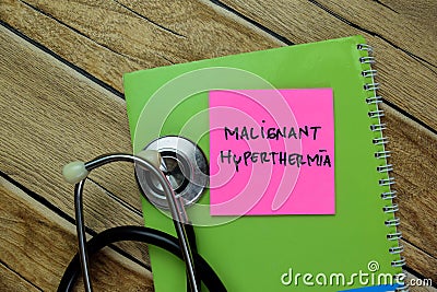 Concept of Malignant Hyperthermia write on sticky notes with stethoscope isolated on Wooden Table Stock Photo