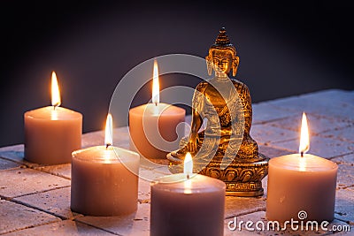 Concept of mindfulness and buddhism with Buddha and lighted candles Stock Photo