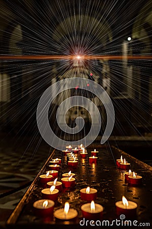 Concept occultism astrology magic. Candles burning in a dark church Stock Photo