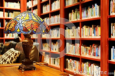 old library study reading room table lamp desk light books bookshelf Stock Photo