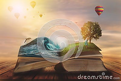 Concept of an open magic book; open pages with ocean and land and small child. Fantasy, nature or learning concept, with copy Stock Photo