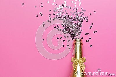 Concept of opening an expensive golden champagne bottle dedicated to the celebration Stock Photo