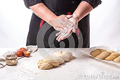 The concept of oriental cuisine. National Israel Braided Challah bread dough. Shabbat Shalom Stock Photo