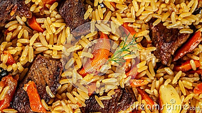 The concept of oriental cuisine. Texture of Uzbek pilaf with meat, vegan pilaf. top view Stock Photo