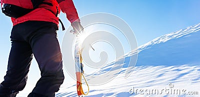 Concept: overcome challenges. Mountaineer faces a climb at the t Stock Photo