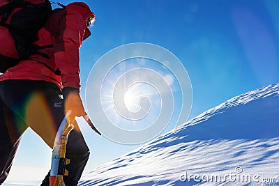 Concept: overcome challenges. Mountaineer faces a climb at the t Stock Photo