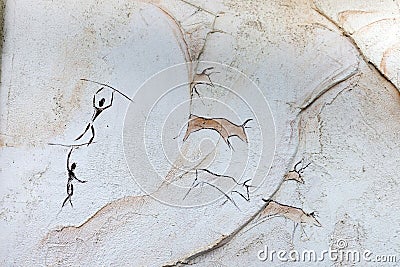 Concept painted on a rock, ancient people hunt animal buffalo with a spear Stock Photo