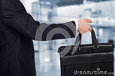 Concept of partnership and teamwork . Businessman passes the case Stock Photo