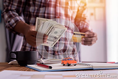 Concept of pay cash, credit card for buy, rent a car Stock Photo