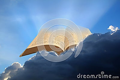 Open bible in clouds sun rays skies sky heaven kingdom god christ jesus heavens miracle prophecy word prayer pray psalms yahweh Stock Photo