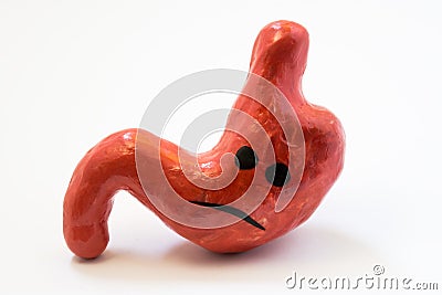 Concept photo of unhappy, sad stomach with discomfort, illness or disorder. Figure of stomach with sad smile, which symbolizes gas Stock Photo