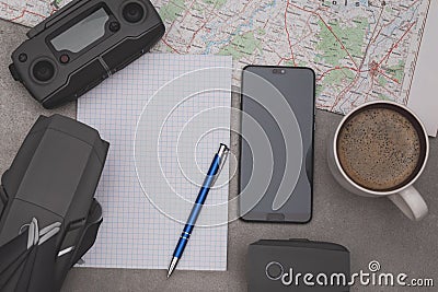 Notepad, drone, smartphone and cup of coffee for plan your drone flight Stock Photo