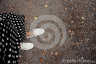 Concept picture of legs walking, Selfie of feet in white sneaker. Stock Photo