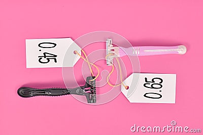Concept for pink tax showing pink and black razor aimed at specific genders with different price tags Stock Photo